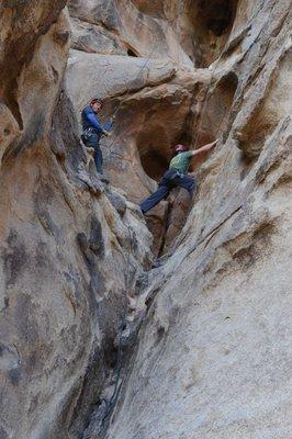 Husband climbing with Luis