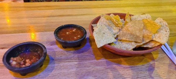 Warm tortilla chips and mild salsa.