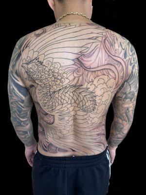 Phoenix full back tattoo in outline stage.
Often we outline the drawing first then about 20 hours of shading to completion