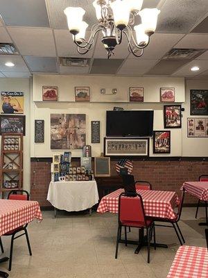 Dining room with table of homemade sauce for sale