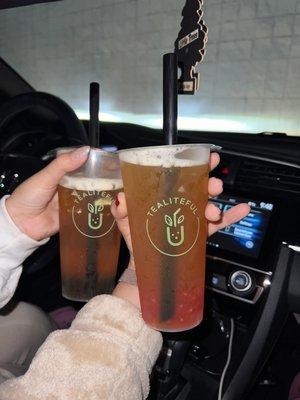 mango fruit tea with tapioca (left), passionfruit fruit tea with strawberry popping boba (right)