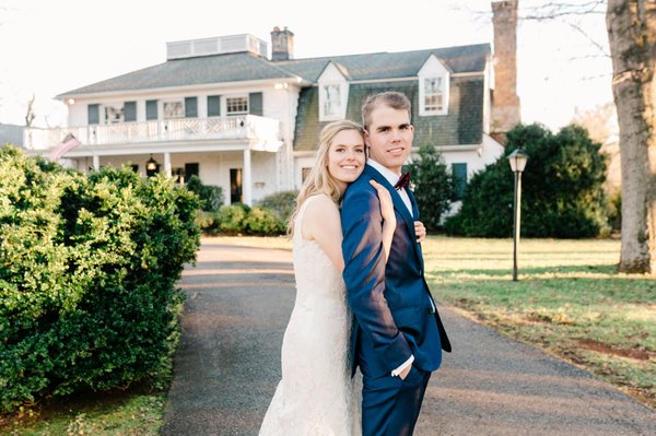 Bride and groom portraits at the front of the Greencroft Club in Charlottesville. (Photo by April B Photography)