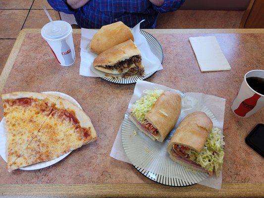 Two slices, spicy Italian, and cheesesteak.  Coworker loved his cheesesteak.