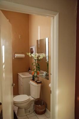 Our cozy orchid filled bathroom awaits!