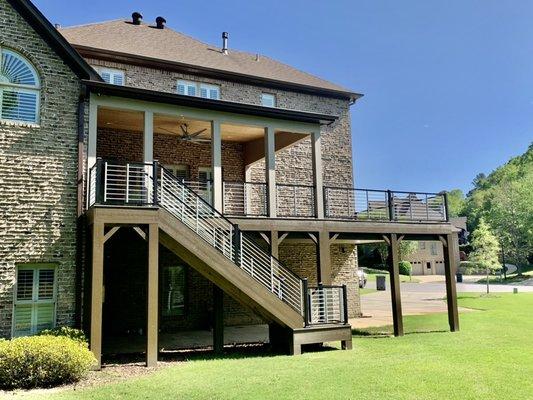 Composite deck with custom porch cover with aluminum railing and tongue and groove ceiling