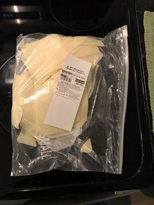 This Walmart deli's idea of how to pack a pound of cheese for a customer.