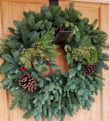 We have Noble Fir wreaths (shown here), with and without additional decoration