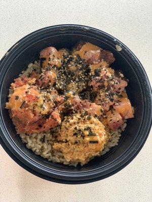 Small poke bowl with ahi tuna and marinated tuna. Sides are spicy crab salad and spicy tuna. Bowl was topped with spicy mayo and furikake.