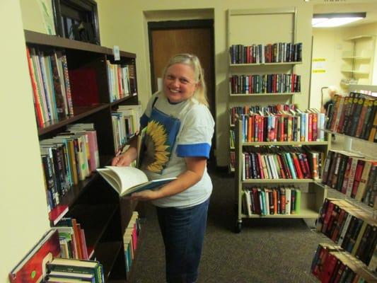 Scruffy person looking at scruffy book