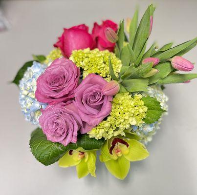 Spring vase arrangement hydrangea, tulips, roses and orchids