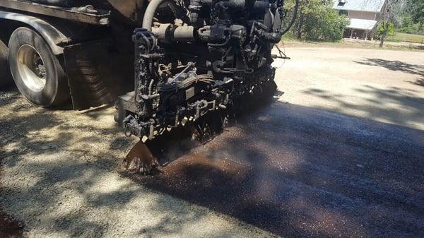 Less expensive way to cut down on that dusty road. Chip Seal , looks great and last a long time.