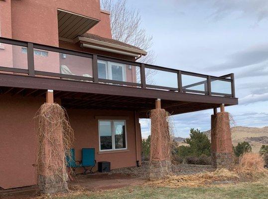 Large composite deck with glass railing to help block the wind.