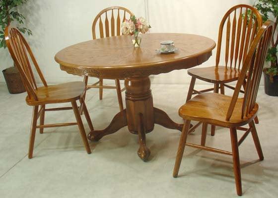 42" Round Table Medium Oak wit Pedestal. Includes 4 Arrow Back Chairs...340.00