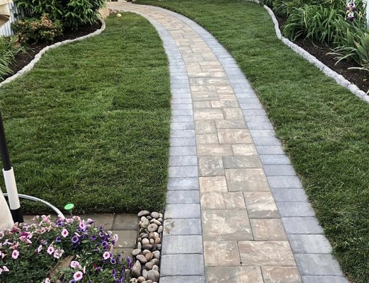 Walkway installed along with sod, and garden edge stone