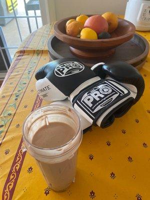 Boxing gloves and protein shake