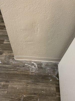 Sloppy paint job that was left by maintenance during a wall repair