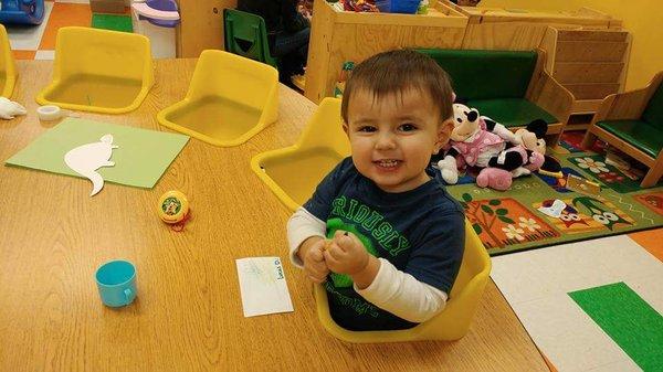 He isn't quite two yet, but they've already taught him how to hold a crayon and draw. He often comes home with arts and crafts.