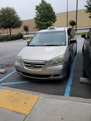 You can see the striped no parking this is a handicap ramp and all the open parking spots behind him and the open spot next too him.