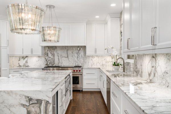 Calacatta Vagli marble countertops and full-height backsplash by Armina Stone.