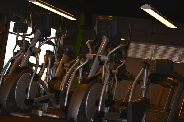 our cardio area, equipped with individual tv's and full cable network.  Our cardio area separate from our weight area too!