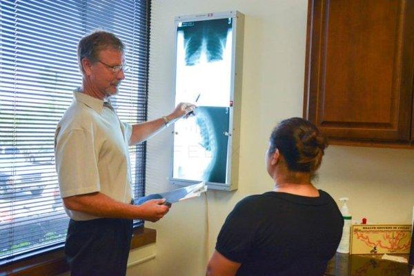 Showing patients their X-rays.