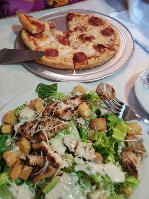 Ceaser salad with grilled chicken and a small pepperoni pizza