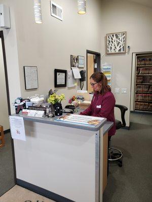 CVT Monica hard at work checking in clients.