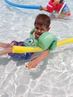 Eli swimming at camp