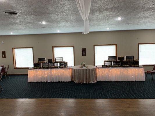 Cake table set up for bride and groom likings.