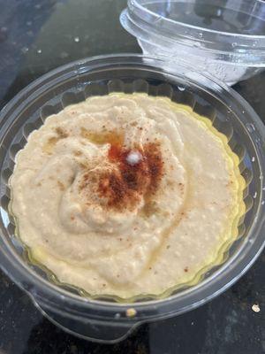 Hummus with white fungus on it indicating this is not fresh.