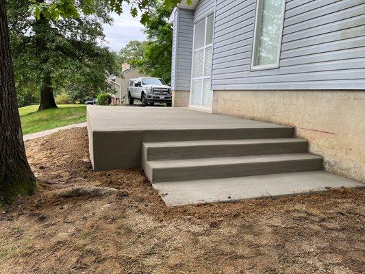 Concrete front patio and stairs