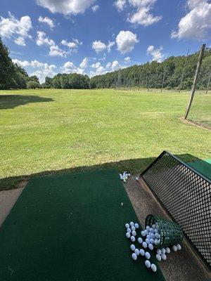 Driving range with artificial turf hitting surface. Open grass range also available.