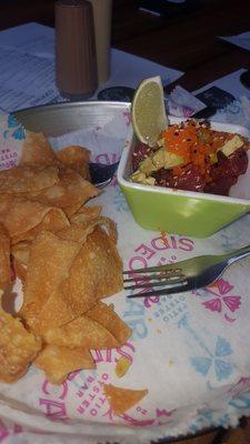 Delicious tuna tartar with fried wontons