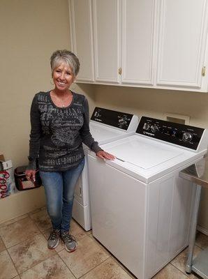 Happy Lubbock Appliance customer with her new Speed Queen Set!