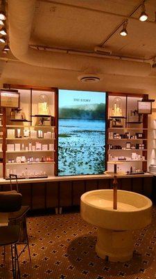 Digital signage built into millwork for displaying skin care products for FRESH.