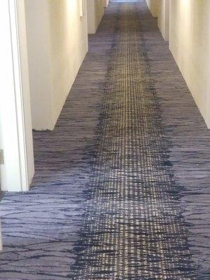 Custom double stick application in a long hotel corridor!!