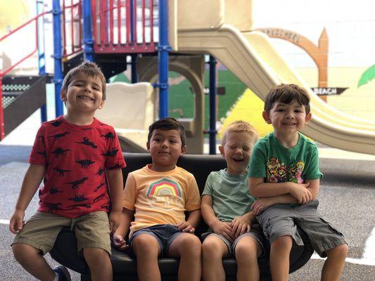 These boys are just hanging out on the playground. The double slide in the background is a favorite of all the students.