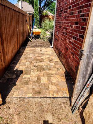 paver area for garbage cans to keep them dry and clean