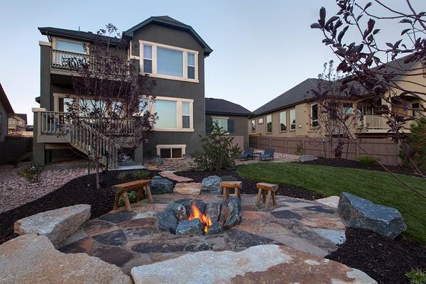 Flagstone patio, wood burning fire pit and custom designed landscaping