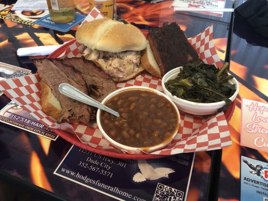 Three Combo Platter with 3 Meats Dinner - ribs, brisket, pulled chicken, baked beans, and collards greens.