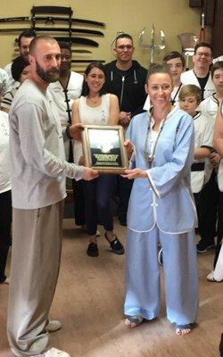 This was awesome!!! Receiving a plaque by the student body for 10 years of helping g other in the arts of Kung Fu and Tai Chi.