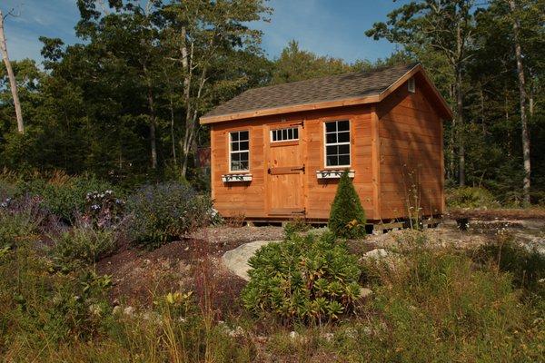 Classic storage building with premiere customer landscaping!