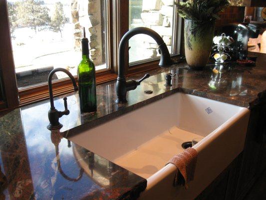 Beautiful under counter mount farm sink with insta-hot dispenser.