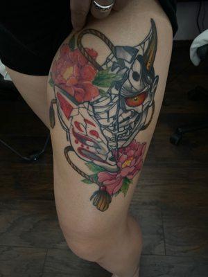 Japanese style tattoo with a kitsune and ogre mask along with peonies and a spiritual/shibari rope.