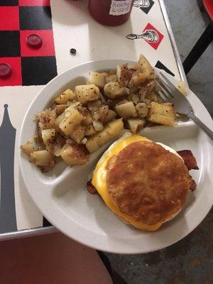 My breakfast, home fries and a bacon egg and cheese biscuit