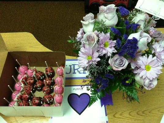 My valentines day surprise. Purple flowers at Purple Heart table from Algonquin flower shoppe. Cake pops from sugar hills!