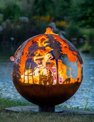 Appel Crisp Farms - 37" farm themed fire pit sphere by Melissa Crisp of The Fire Pit Gallery Cow, tractor https://www.thefirepitgallery.com/