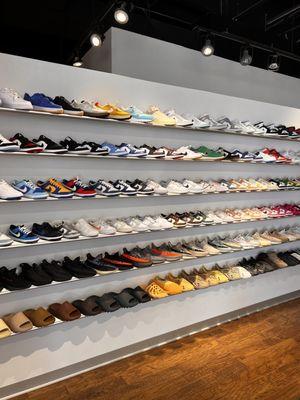 The large sneaker wall filled with dunks, Jordan's, Yeezys, and more