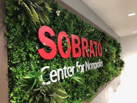 This lobby logo for Sobrato was placed on a living wall.