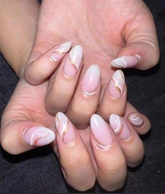 Acrylic pink and white ombré with almond shape and designs.